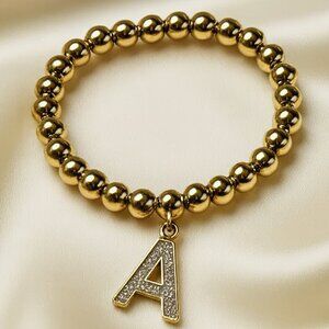 Gold Beaded Stretch Bracelet w/ Colorful Dazzling "A" Charm – Fashion Jewelry